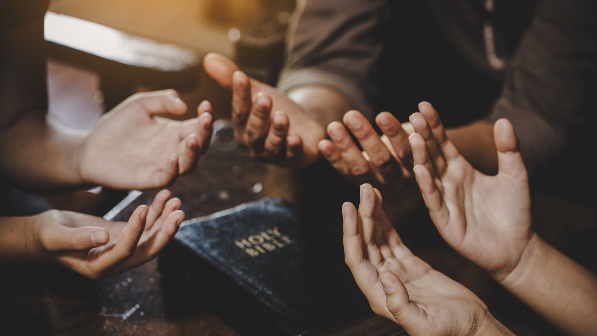 3 pairs of hands praying together